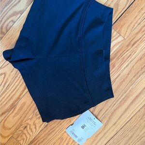 Girls Athleta black wide leg shorts.